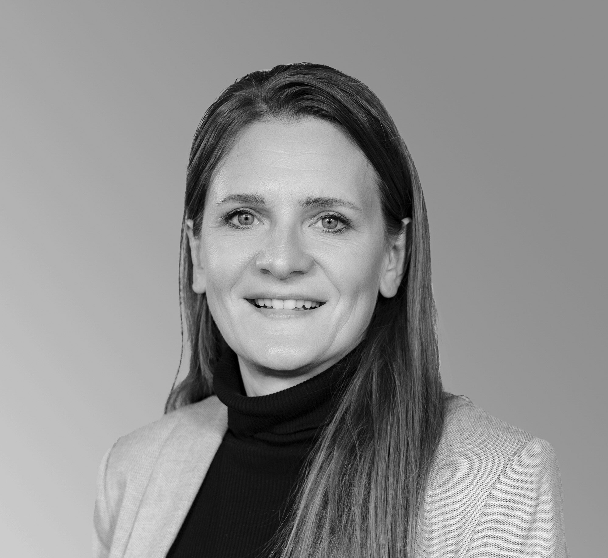 Portrait von Silvia Hiller, Technical Administration Manager at VIECON, photographed in a professional black-and-white setting.